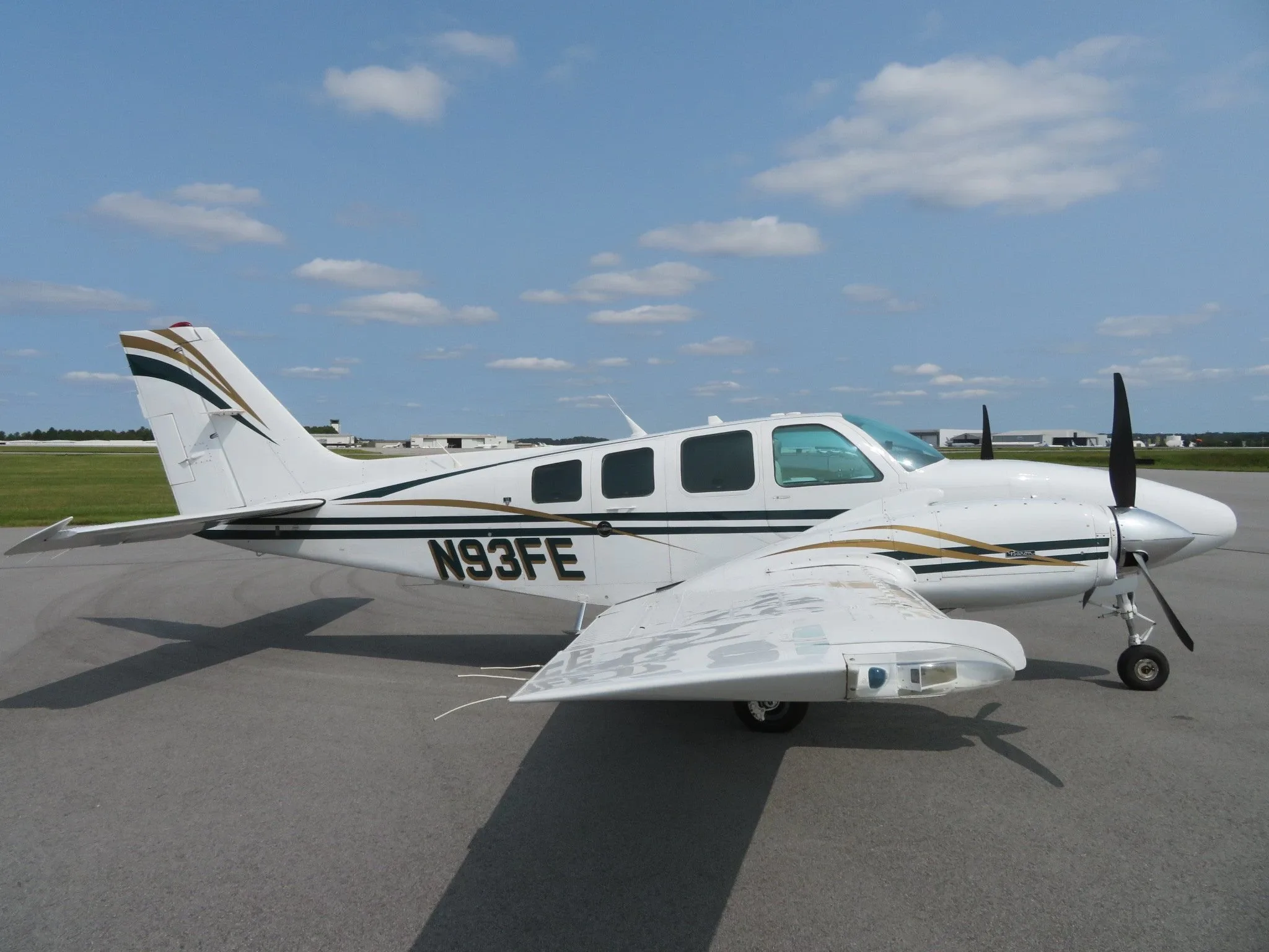Exterior view of a Beechcraft Twin Piston Baron 58, N93FE.
