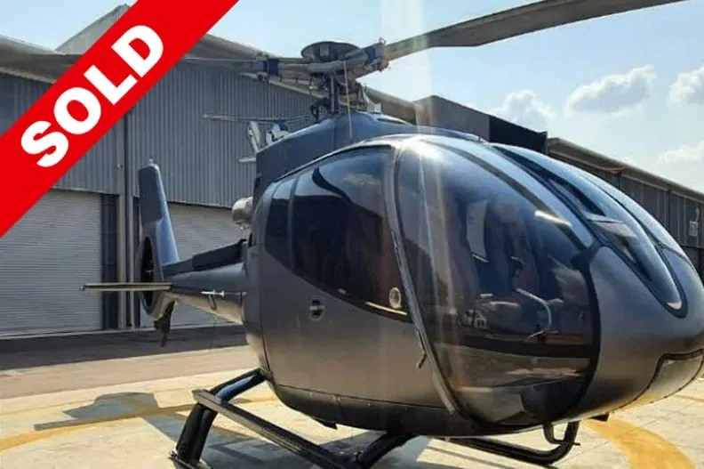 Exterior view of a 2002 Robinson R22 Beta II.