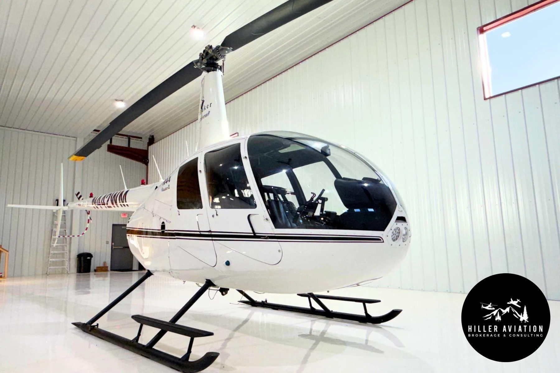 Exterior view of a 2006 Robinson R44 Raven II.