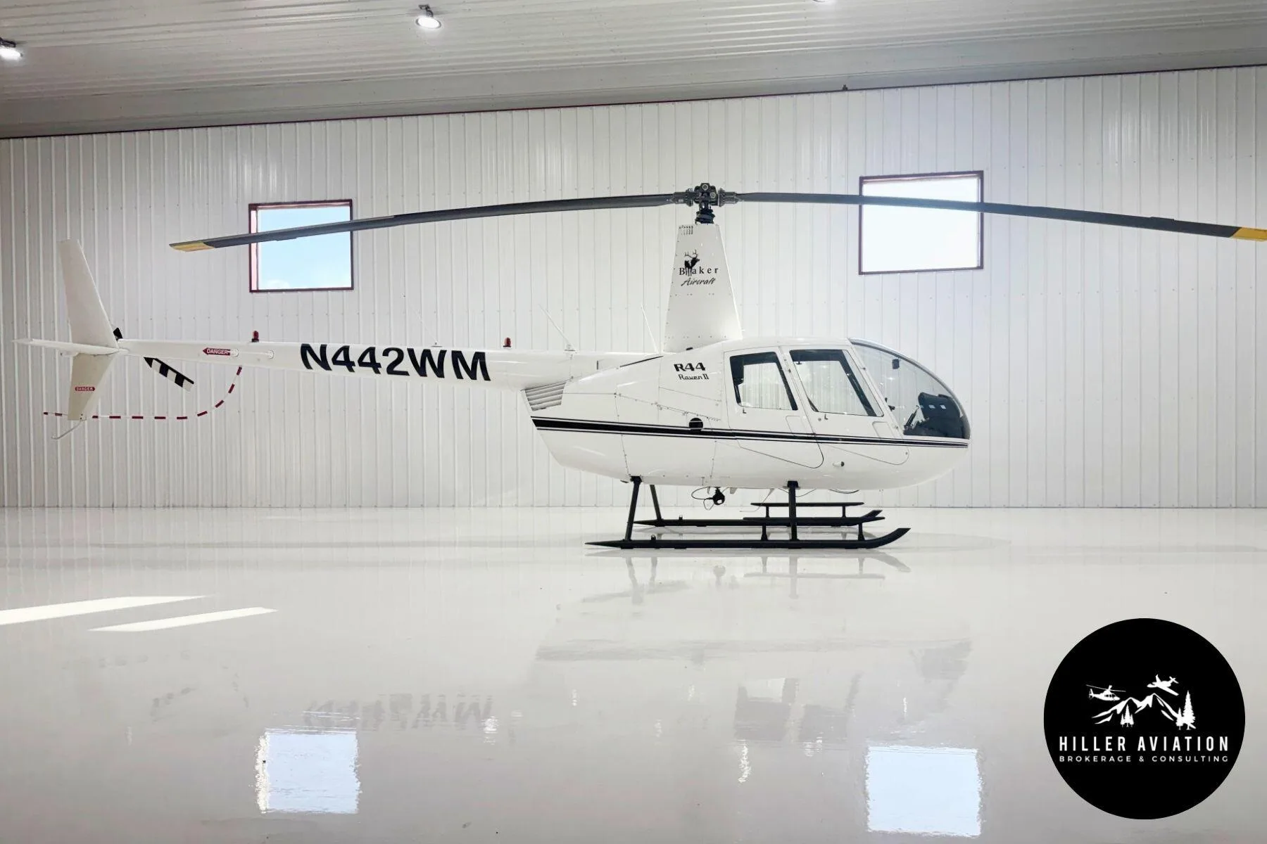 Exterior view of a 2006 Robinson R44 Raven II.