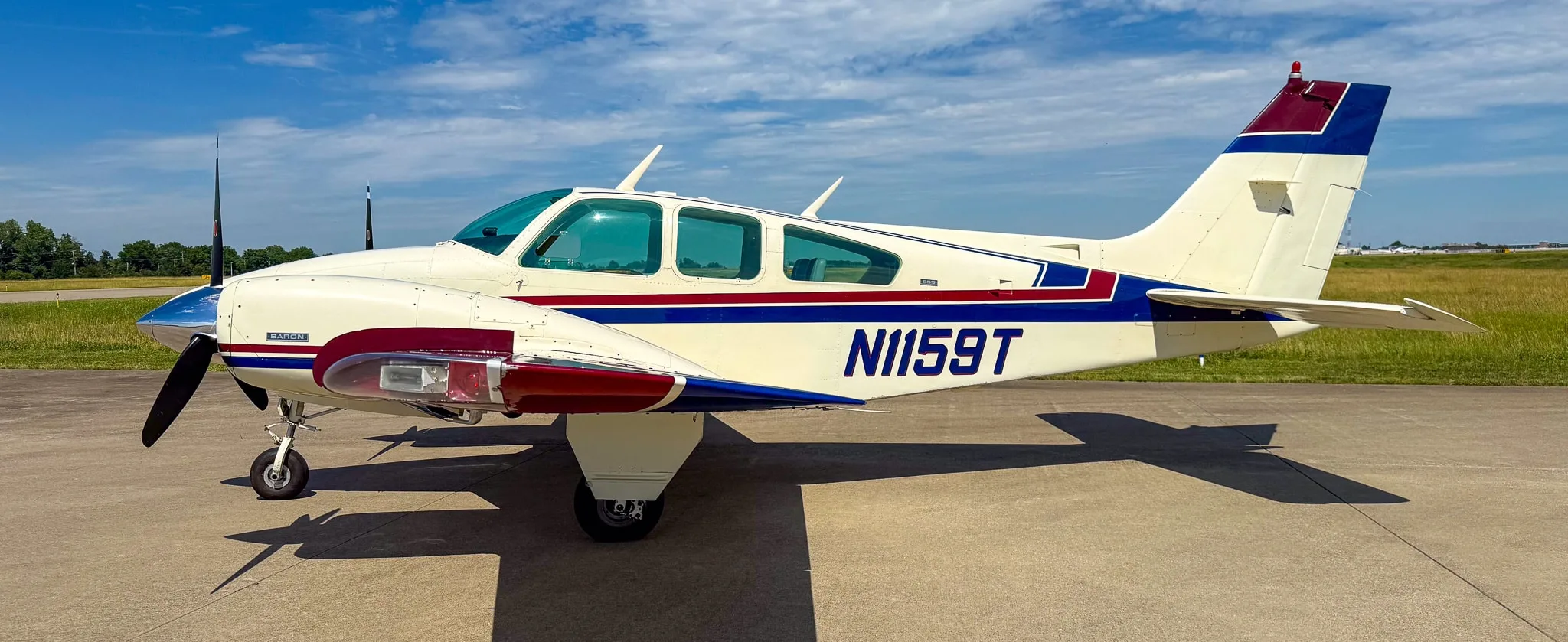 Exterior view of a 1974 Beechcraft B55 Baron, N1159T.