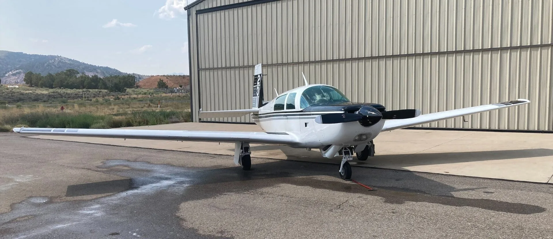 Exterior view of a 1985 Mooney M20J, N5812T.