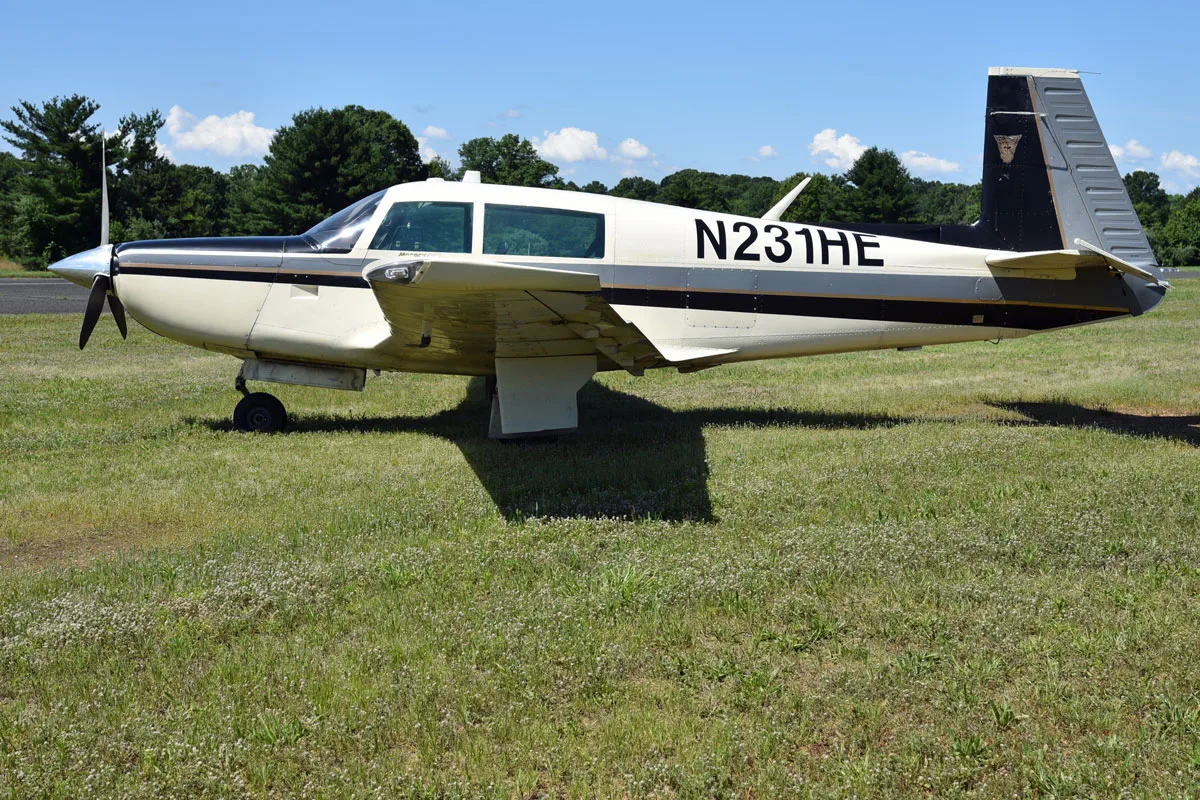 Exterior view of a 1979 Mooney M20K 231 ’80, N231HE.