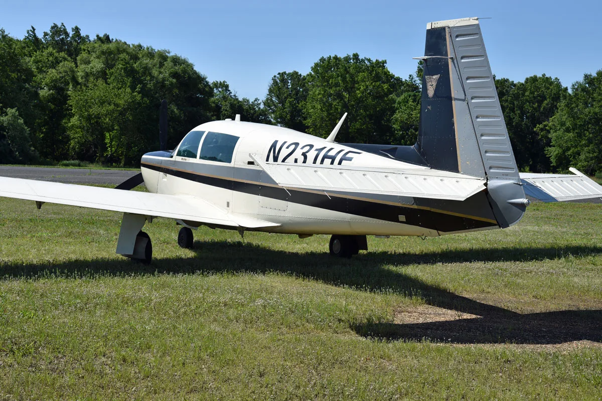 Exterior view of a 1979 Mooney M20K 231 ’80, N231HE.