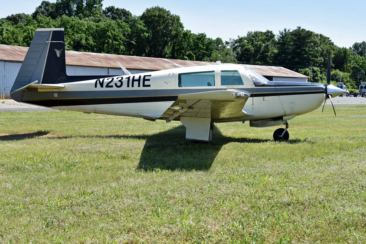 Exterior view of a 1979 Mooney M20K 231 ’80, N231HE.