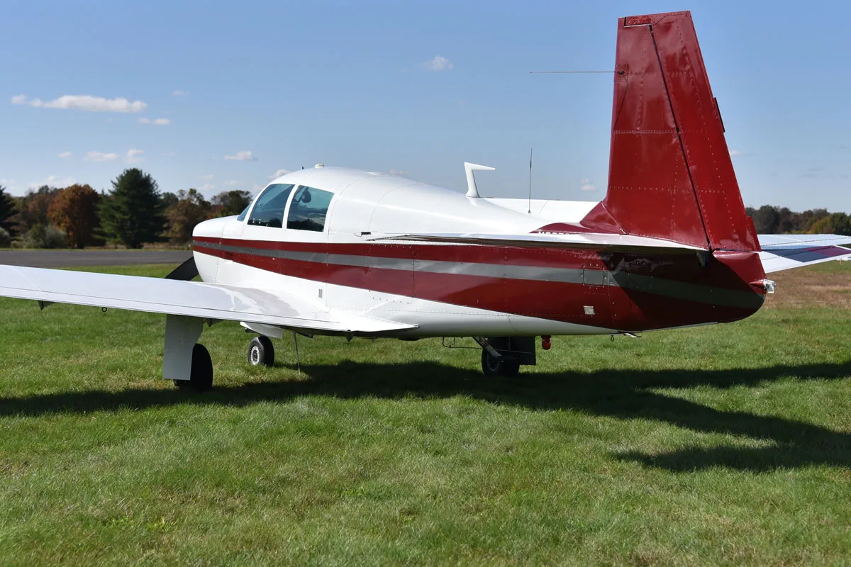 Exterior view of a 1966 Mooney M20C, N2672W.