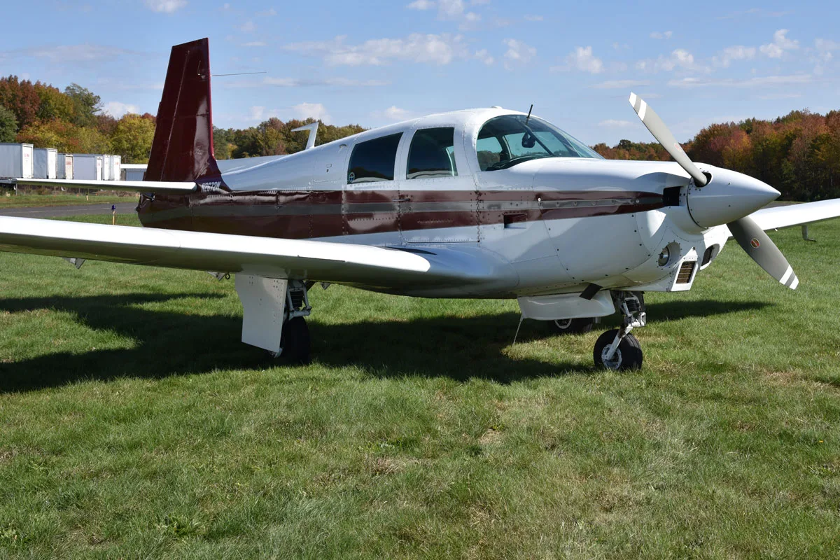 Exterior view of a 1966 Mooney M20C, N2672W.