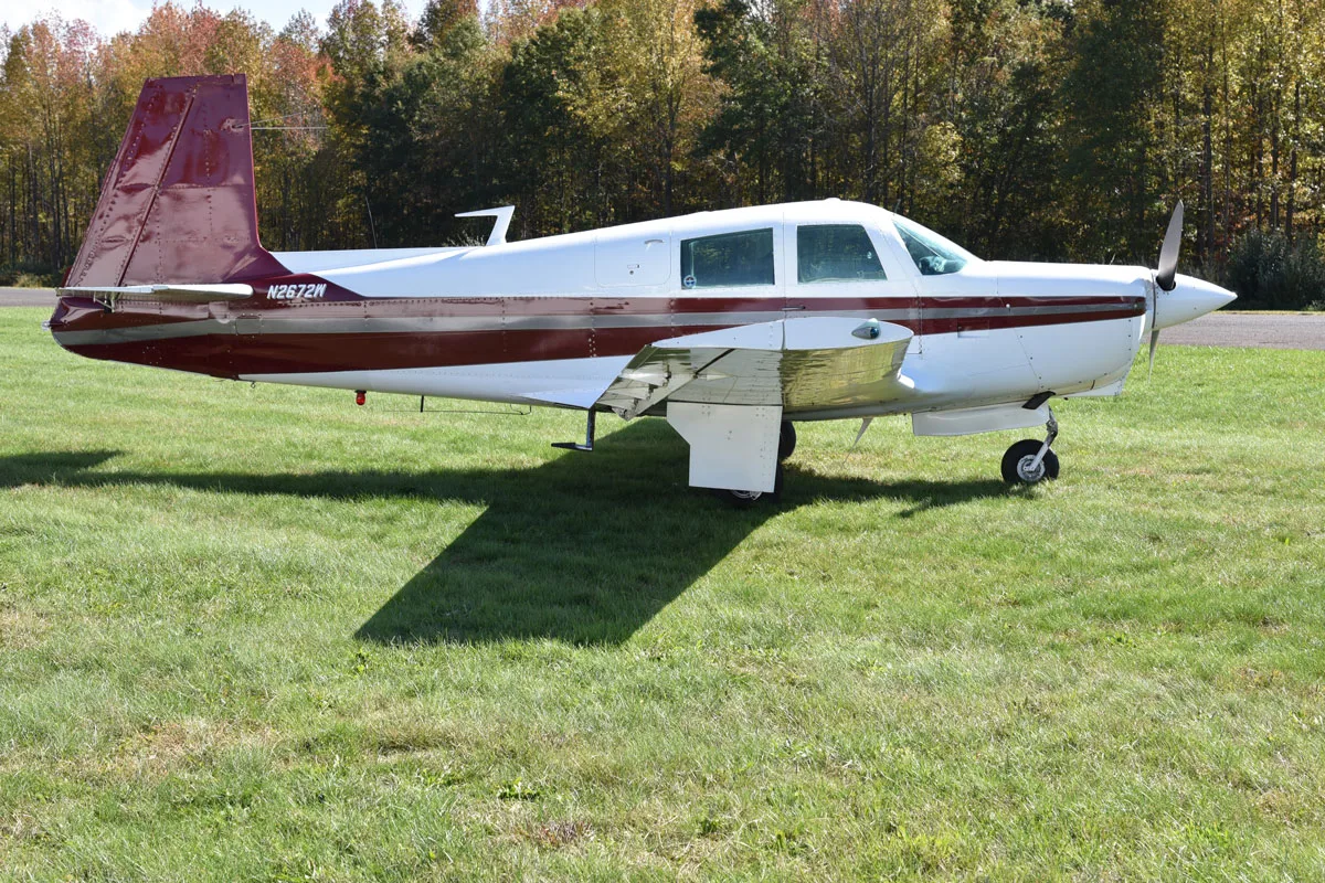 Exterior view of a 1966 Mooney M20C, N2672W.