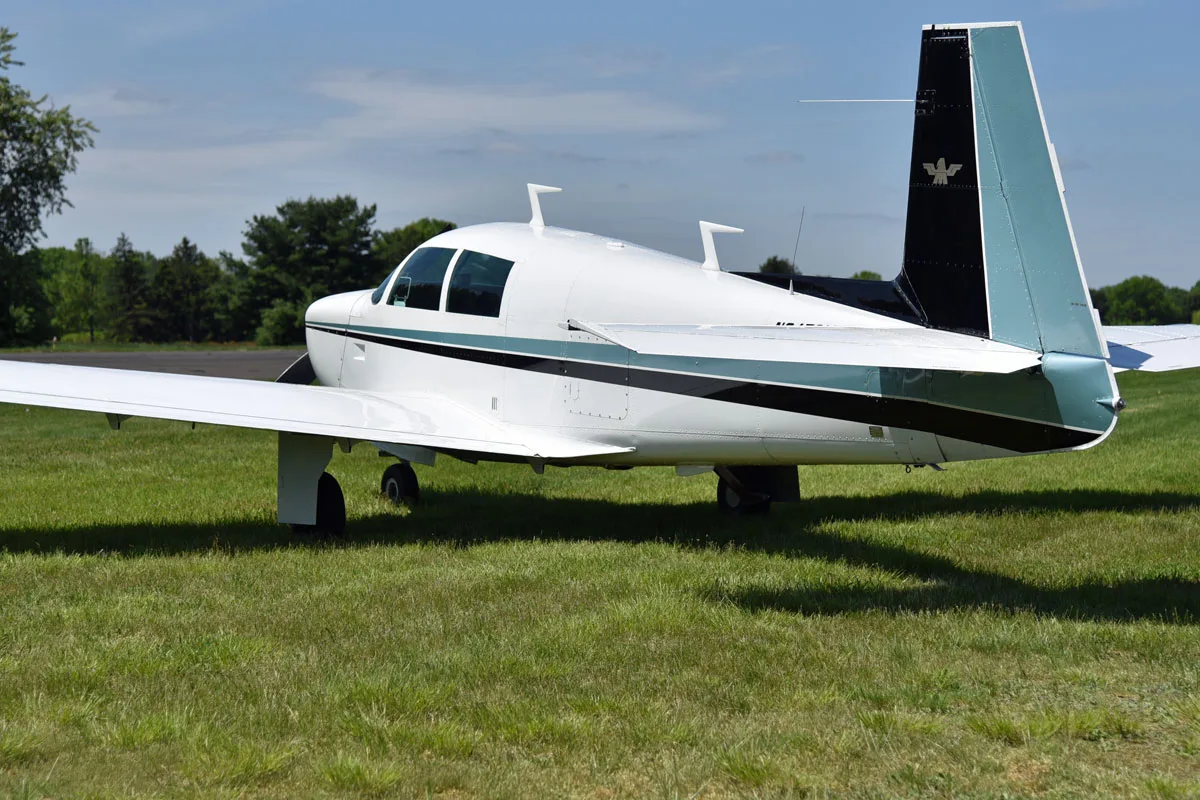 Exterior view of a 1966 Mooney M20E Super 21, N3479X.
