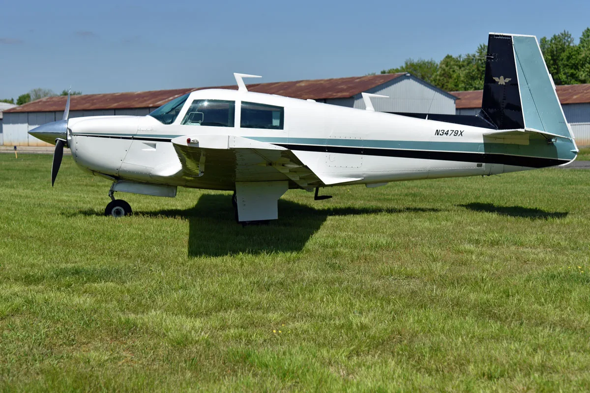 Exterior view of a 1966 Mooney M20E Super 21, N3479X.
