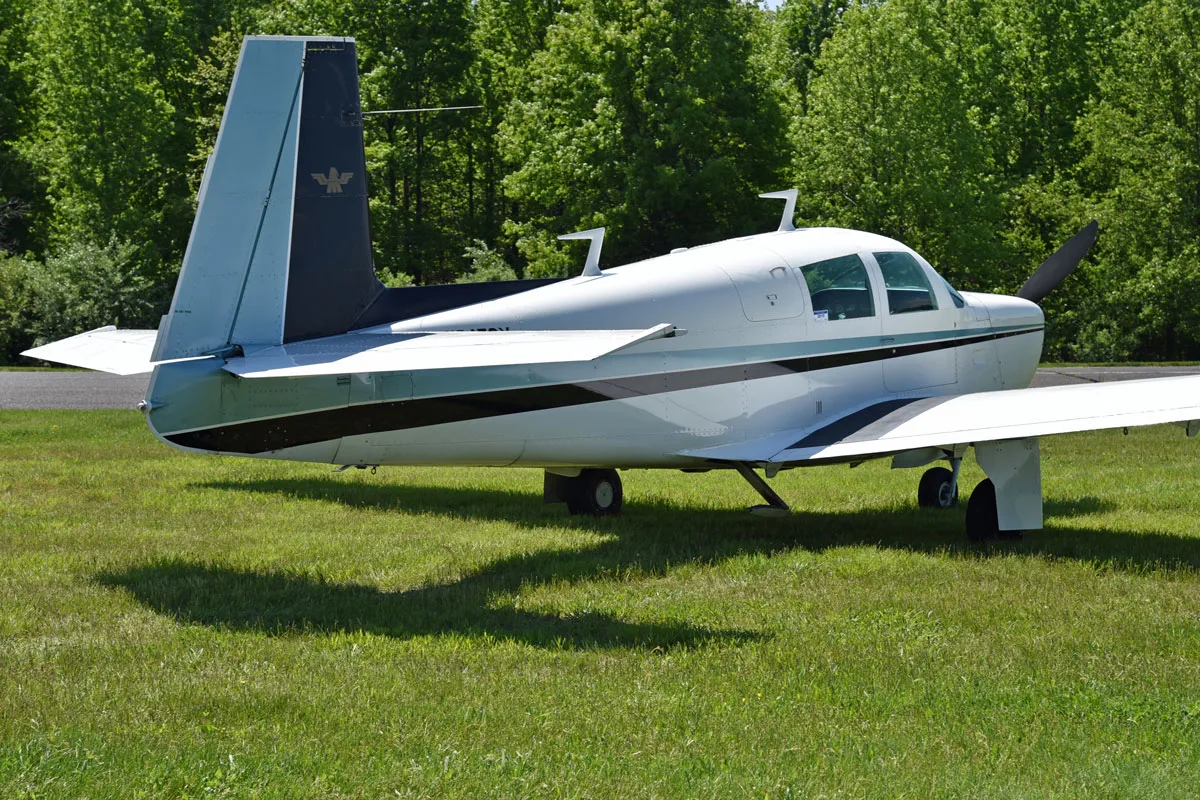 Exterior view of a 1966 Mooney M20E Super 21, N3479X.