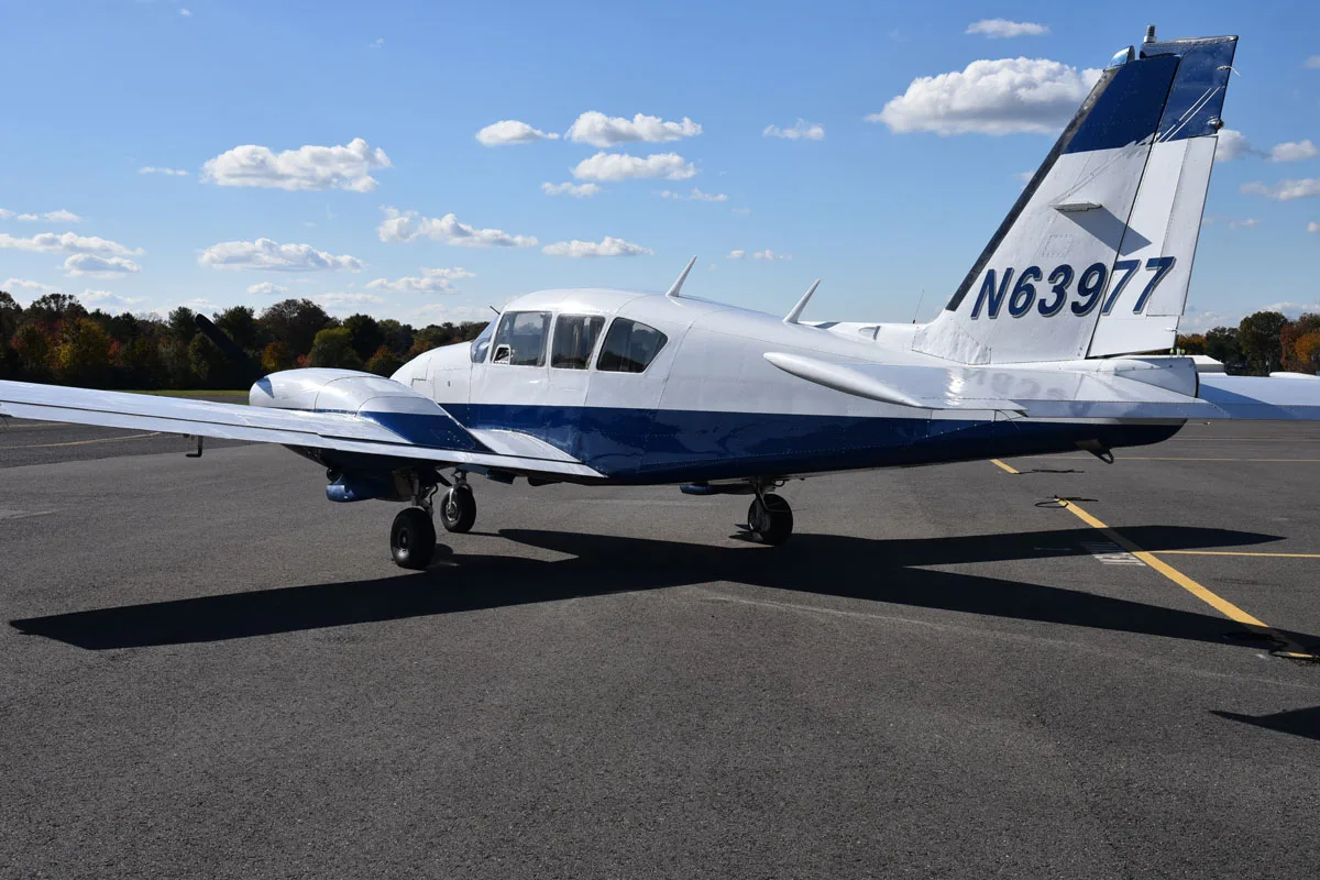 Exterior view of a 1978 Piper Aztec F, N63977.