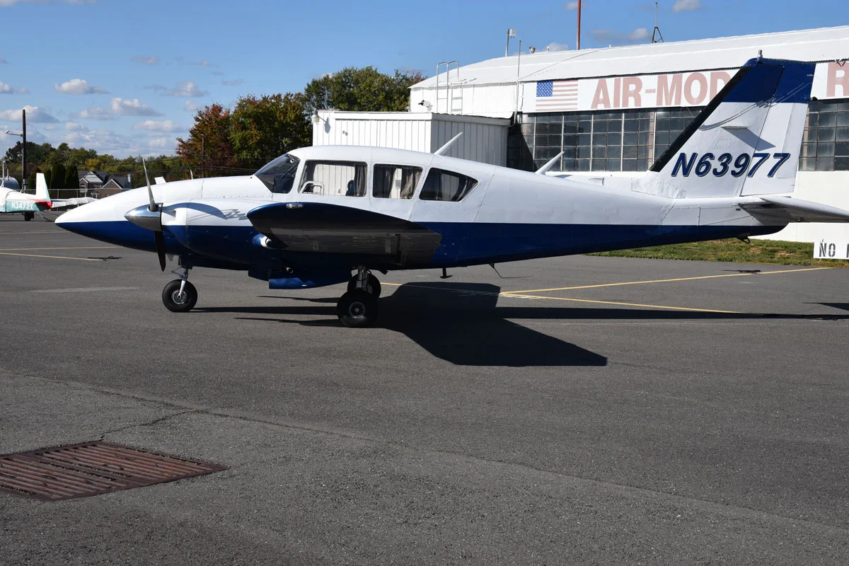 Exterior view of a 1978 Piper Aztec F, N63977.