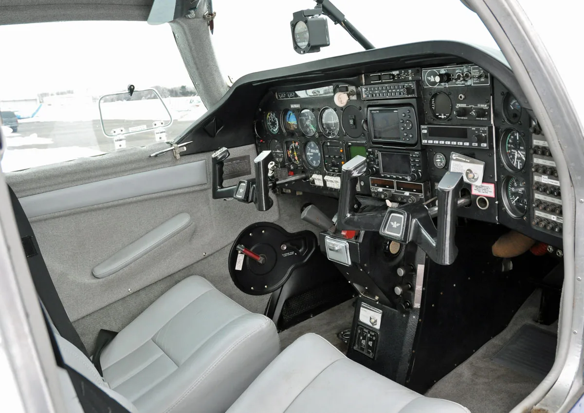 Cockpit and instrument panel of a 1976 Mooney M20F Executive.
