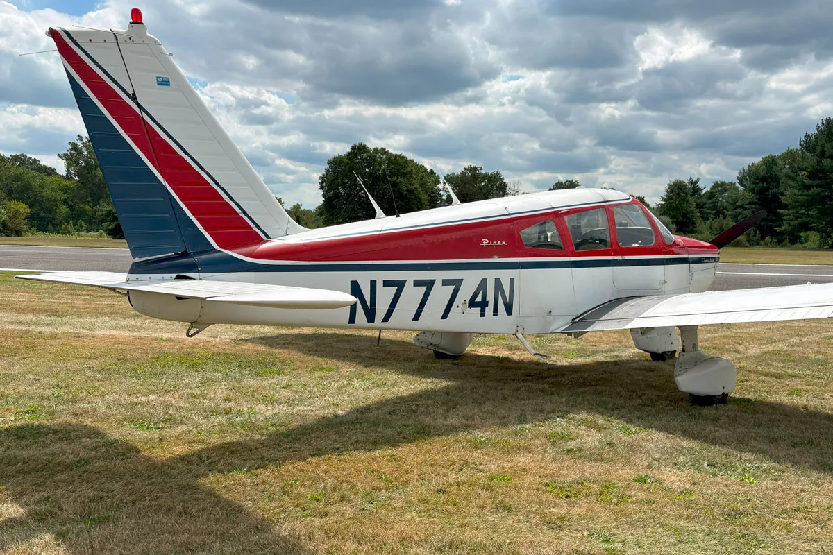 Exterior view of a 1968 Piper PA-28-180D Cherokee, N7774N.
