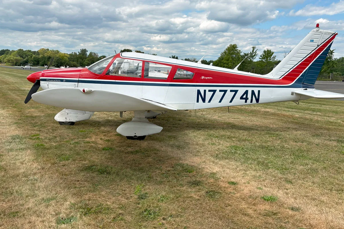 Exterior view of a 1968 Piper PA-28-180D Cherokee, N7774N.