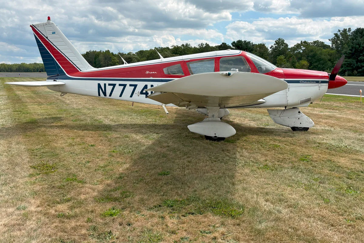 Exterior view of a 1968 Piper PA-28-180D Cherokee, N7774N.