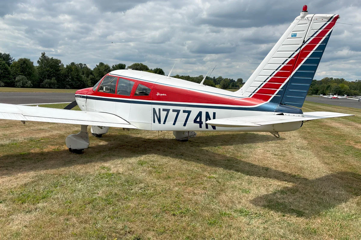 Exterior view of a 1968 Piper PA-28-180D Cherokee, N7774N.