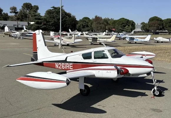 Exterior view of a 1956 Cessna 310, N261RE.