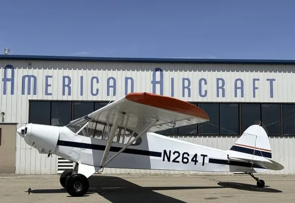 Marketing image of a 1953 Piper Super Cub PA-18.