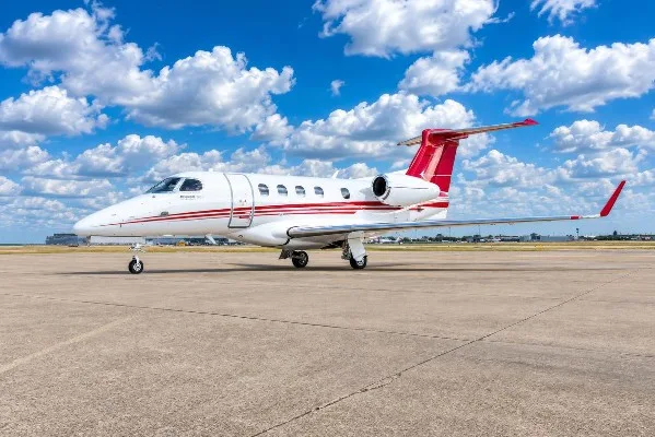 Exterior view of a 2020 Embraer Phenom 300.