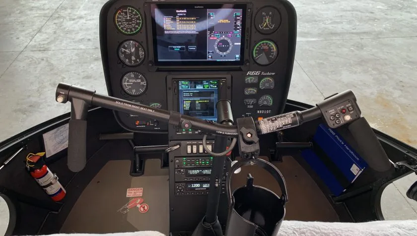 Cockpit and instrument panel of a 2018 Robinson R66 0891.