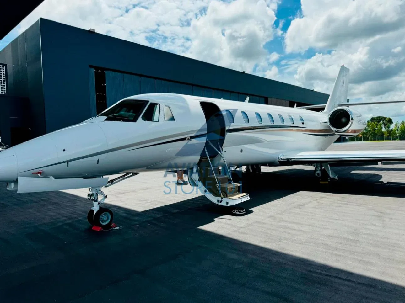 Exterior view of a 2009 Embraer Phenom 100.