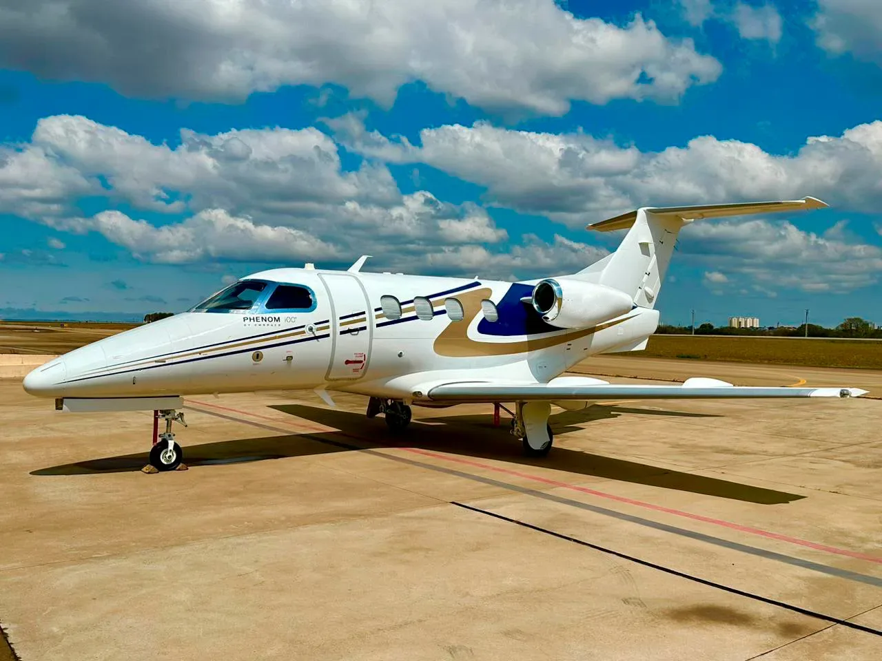 Exterior view of a 2011 Embraer Phenom 100.