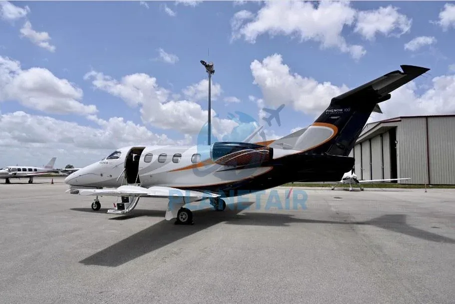 Exterior view of a 2011 Embraer Phenom 100.