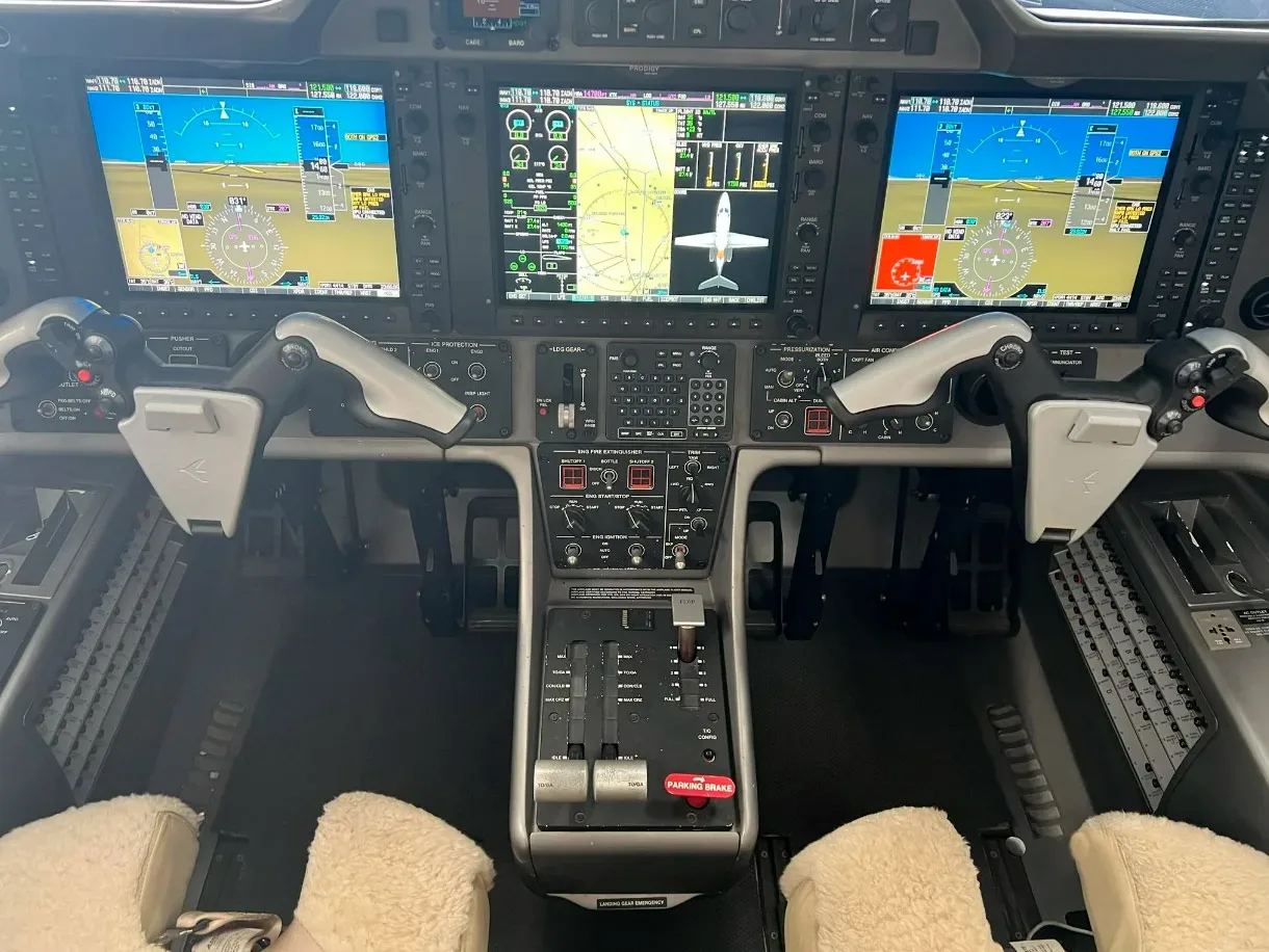 Cockpit and instrument panel of a 2013 Embraer Phenom 100.