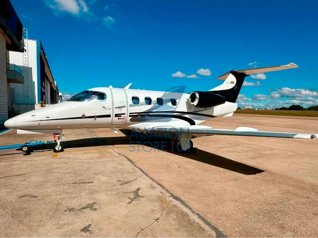 Exterior view of a 2013 Embraer Phenom 100.