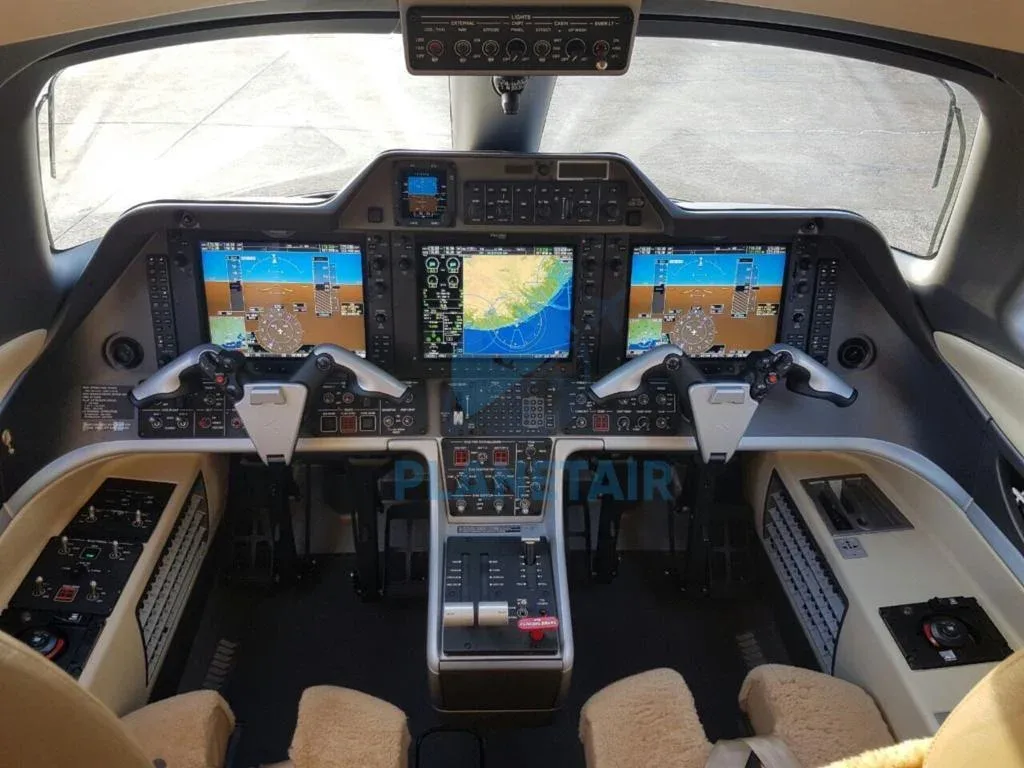 Cockpit and instrument panel of a 2013 Embraer Phenom 300.