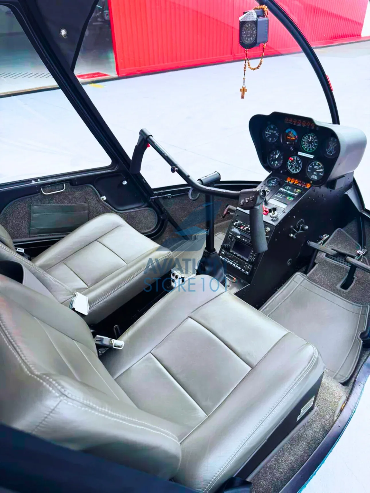 Cockpit and instrument panel of a 2009 Robinson R44 Raven II.