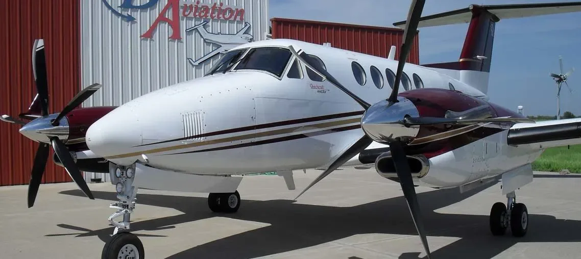 Exterior view of a 1987 Beechcraft King Air 300 Blackhawk -67A’s Garmin G1000 NXI Raisbeck New 5 Bladed Hartzell Props.