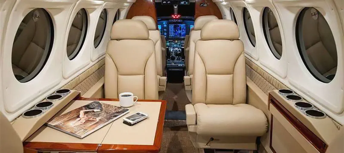 Cabin interior of a 1998 Beechcraft King Air B200 Blackhawk -61’s Garmin G1000 Raisbeck.