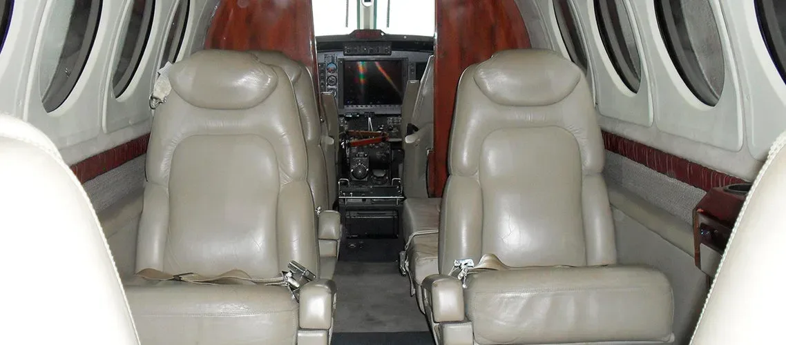 Cabin interior of a 2002 Beechcraft King Air B200 Blackhawk -61’s Garmin G1000 Raisbeck Cargo Pod.
