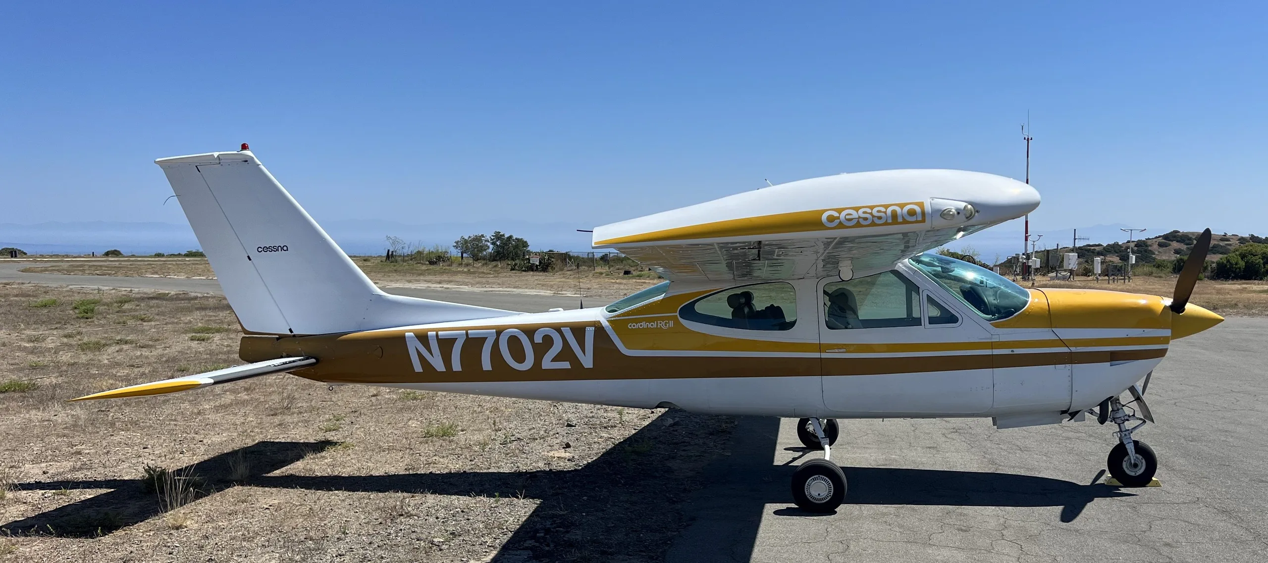 Exterior view of a 1976, N7702V.