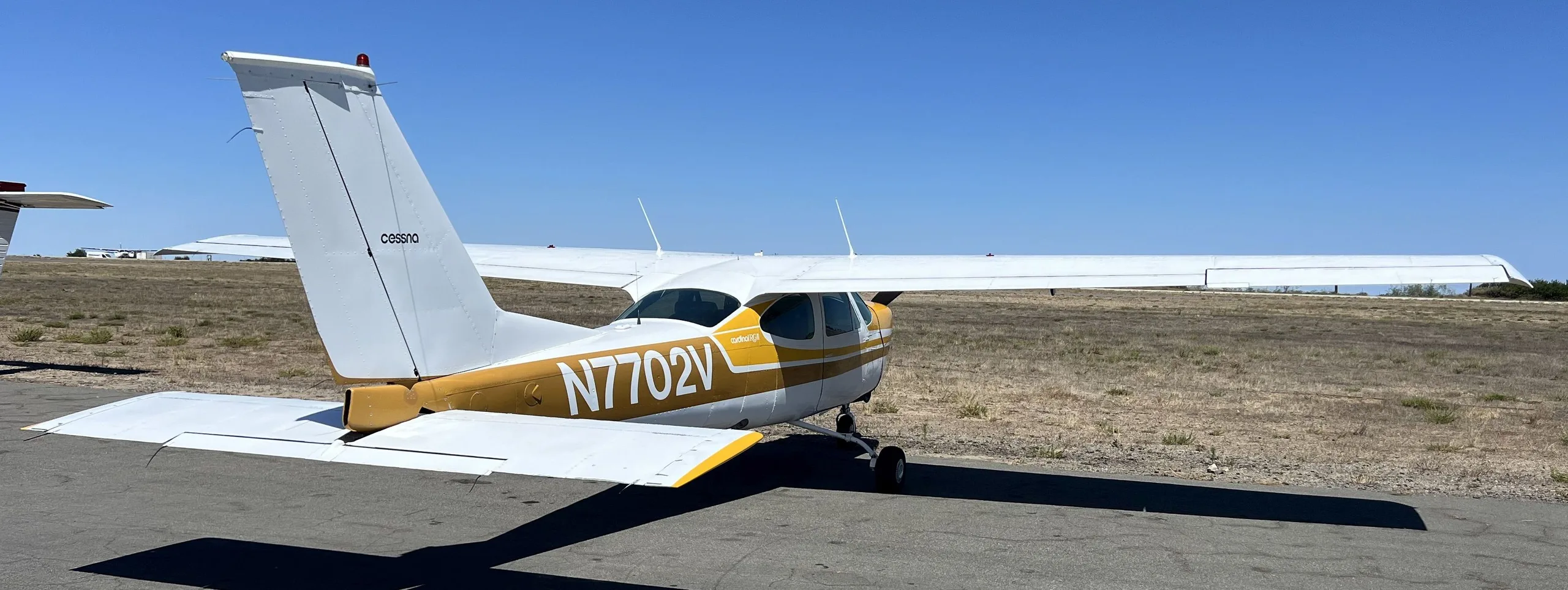 Exterior view of a 1976, N7702V.