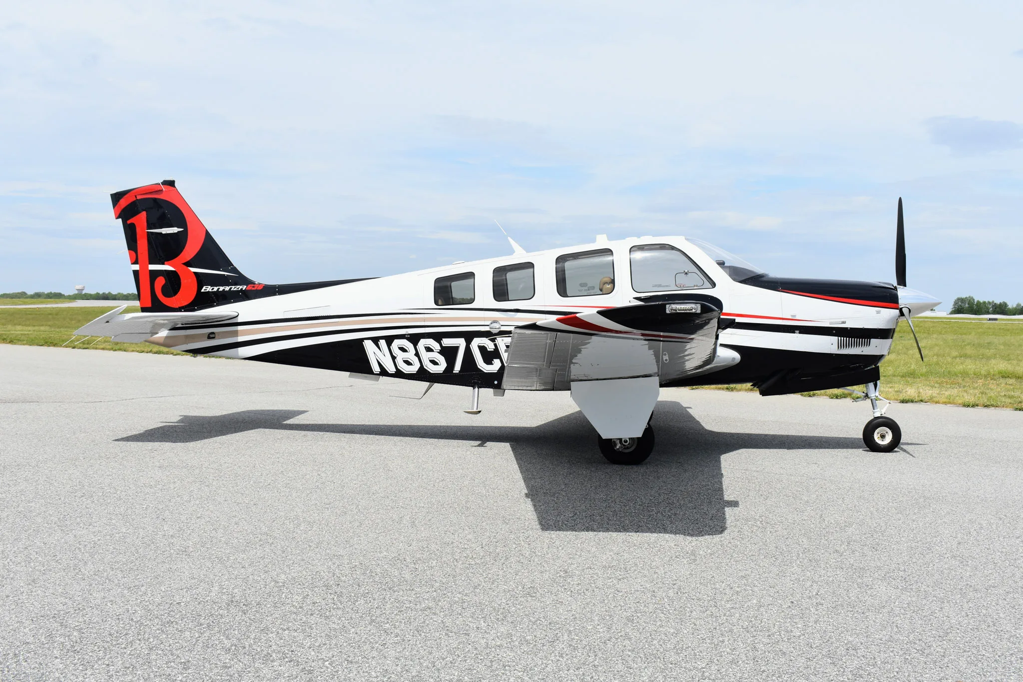 Exterior view of a 1991 Beechcraft Bonanza A36 * 405,000 with Bonanza School.