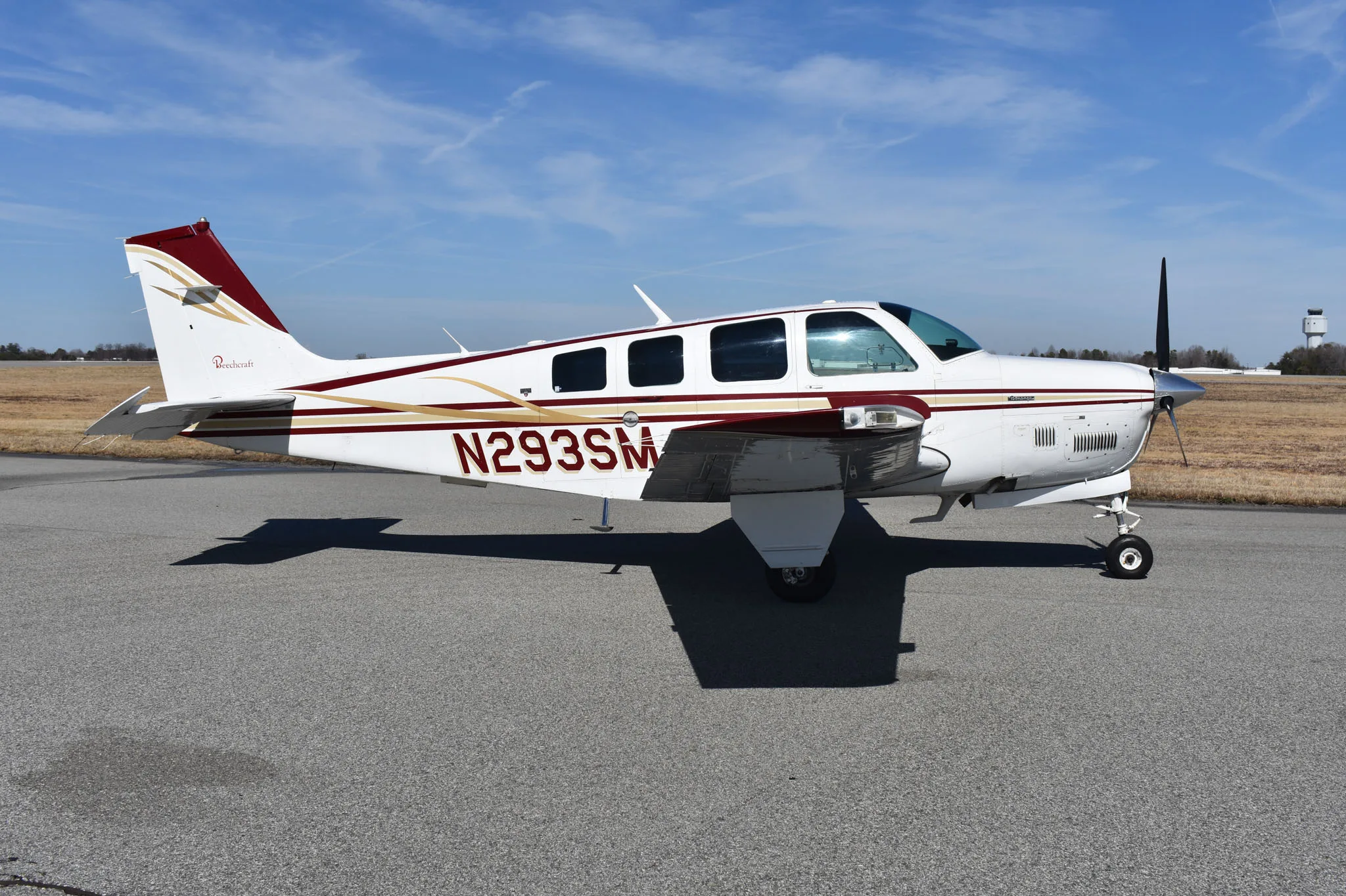 Exterior view of a 1991 Beechcraft Bonanza A36 * 405,000 with Bonanza School.