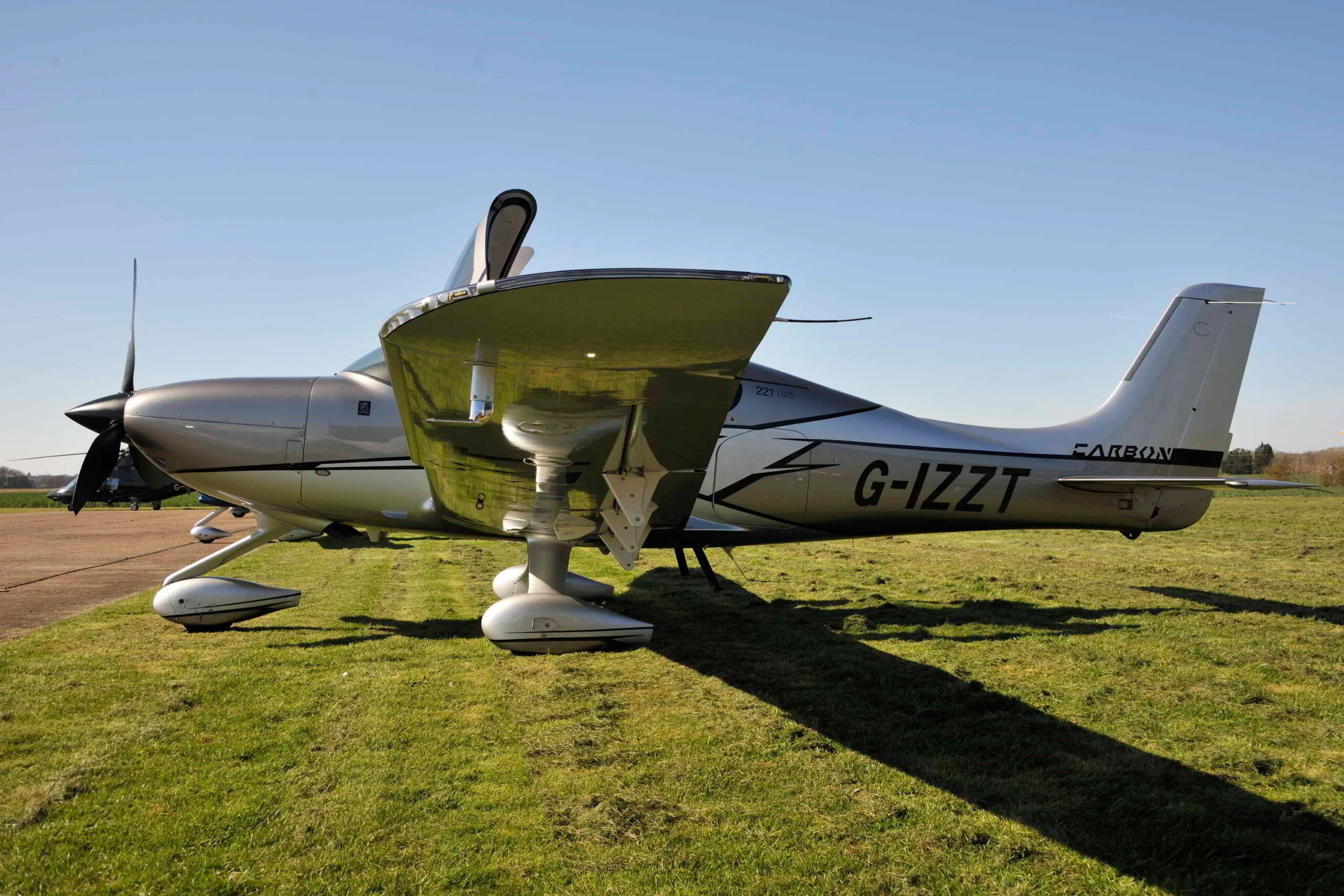 Exterior view of a 2018 Cirrus SR22T GTS G6 FIKI, G-IZZT.