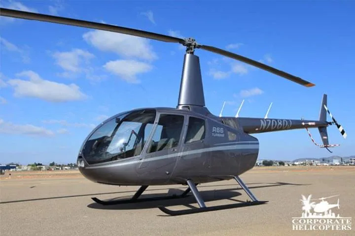Exterior view of a 2013 Robinson R66 Turbine, N7080J.