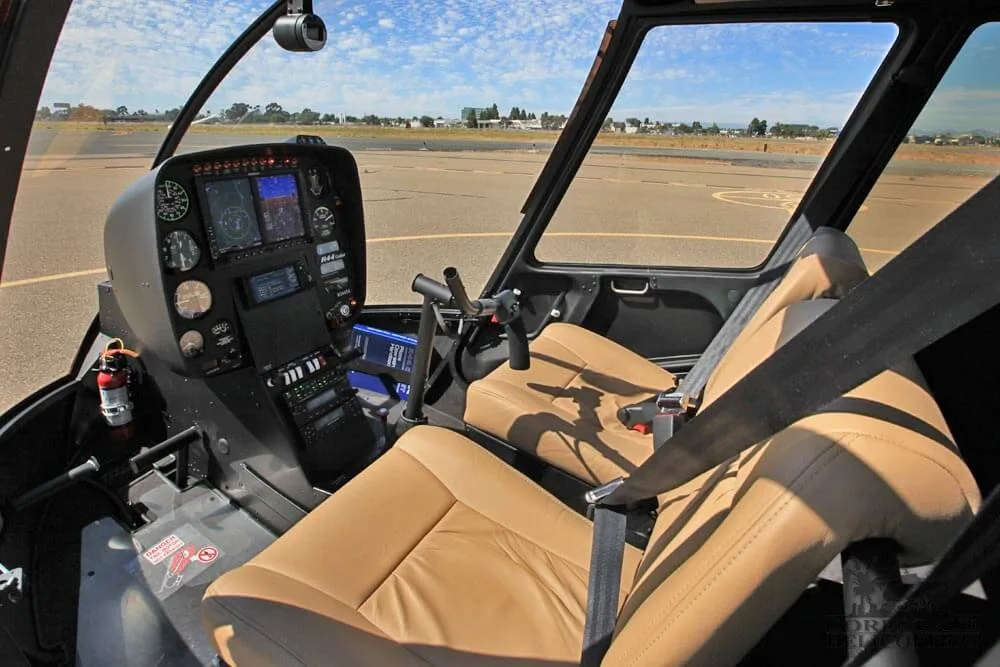 Cockpit and instrument panel of a 2017 Robinson R44 Cadet.