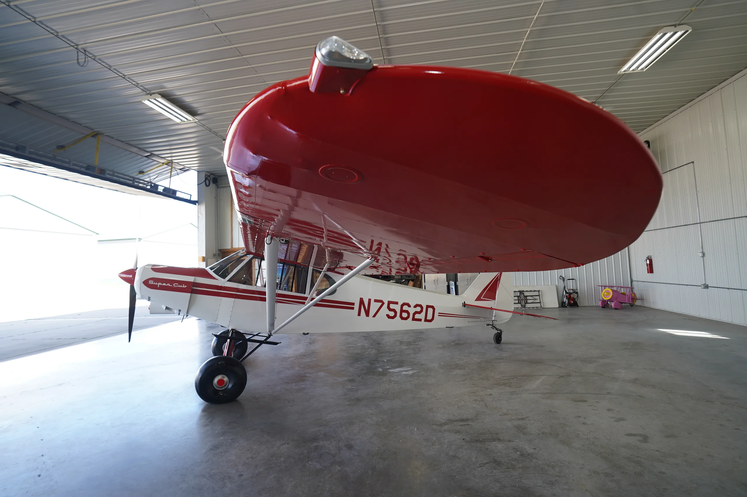Exterior view of a 1957 Piper super cub, N7562D.