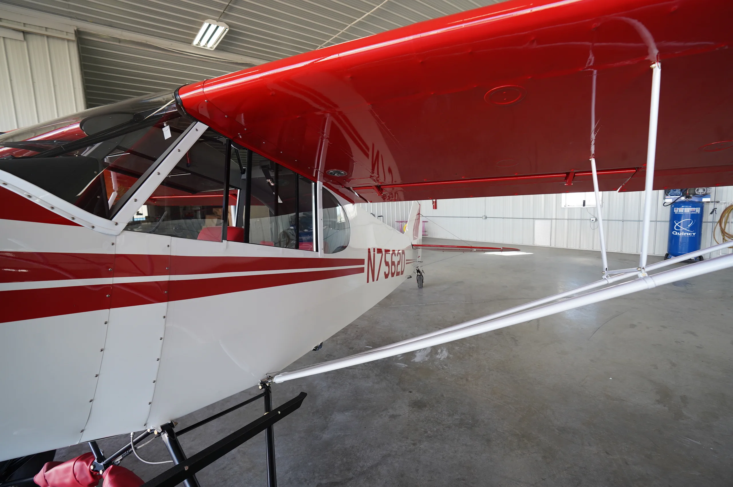 Exterior view of a 1957 Piper super cub, N7562D.