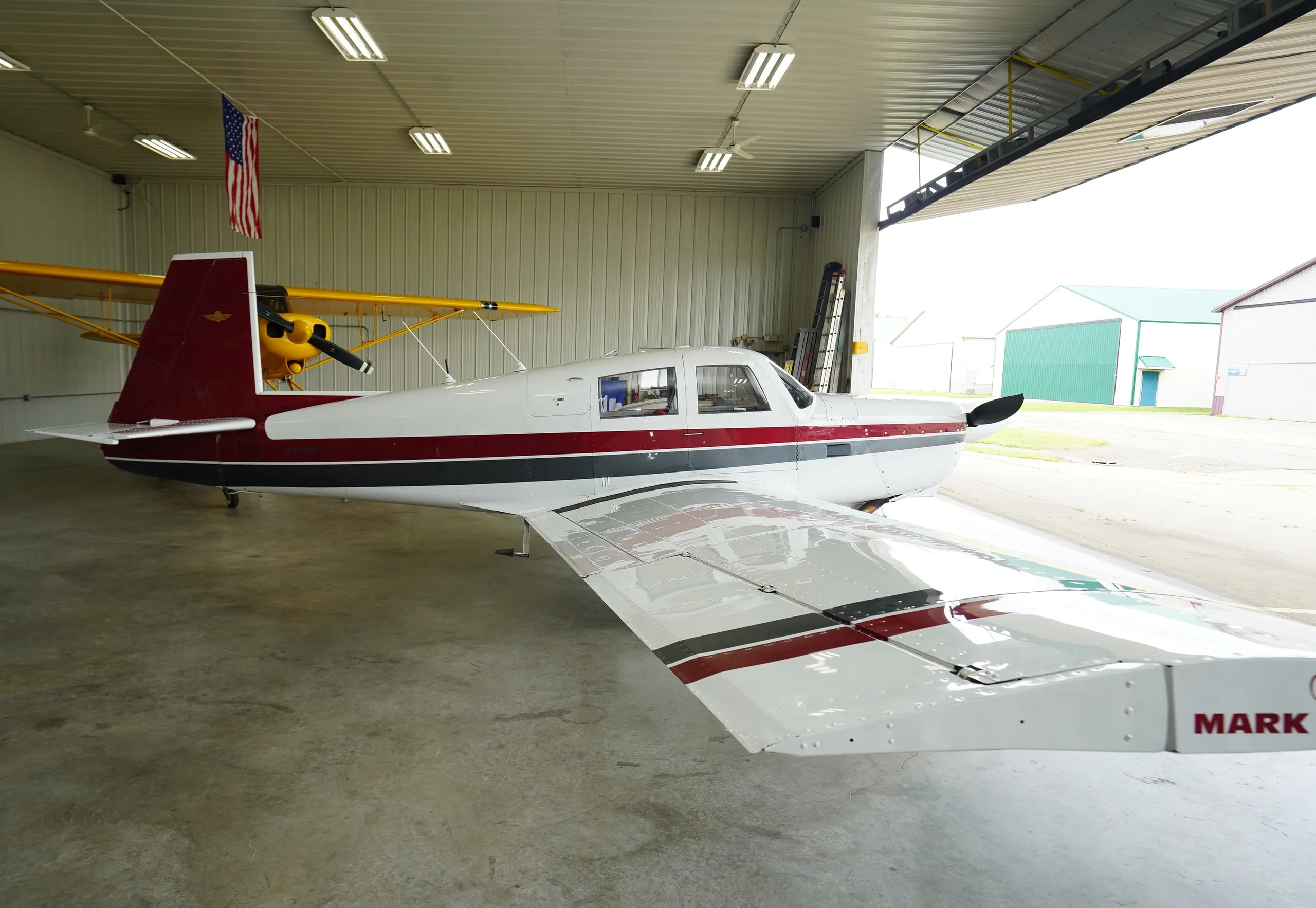 Exterior view of a Mooney M20C, N9211M.