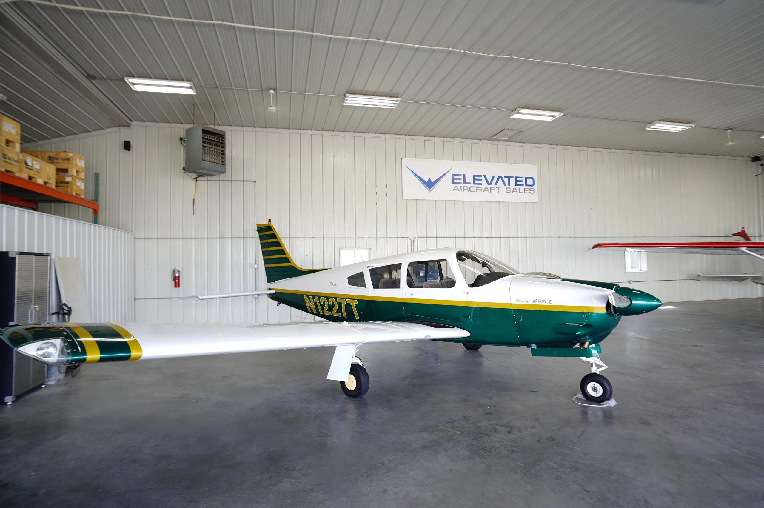Exterior view of a 1972 Piper Archer II, N1227T.