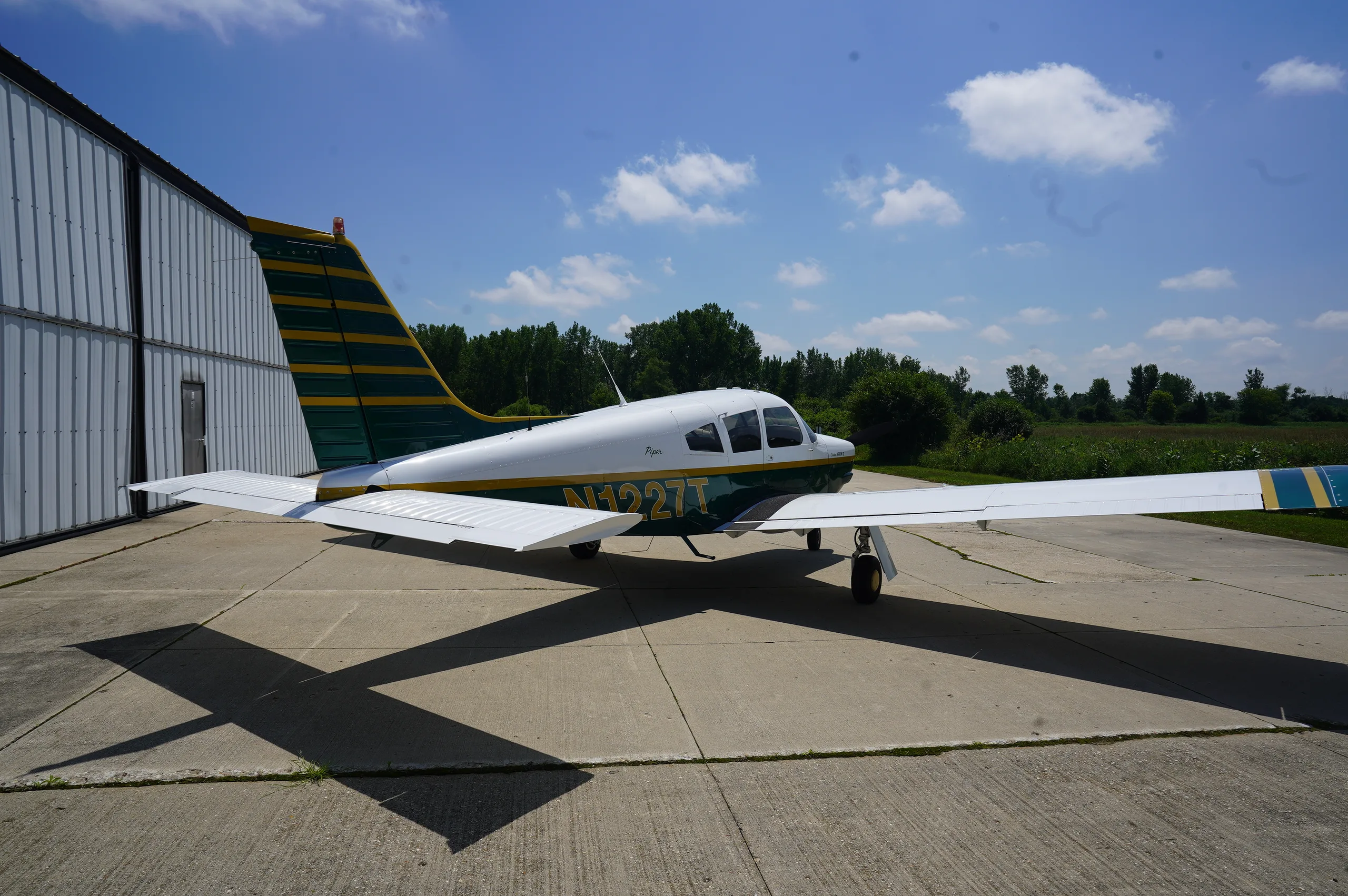 Exterior view of a 1972 Piper Arrow II, N1227T.