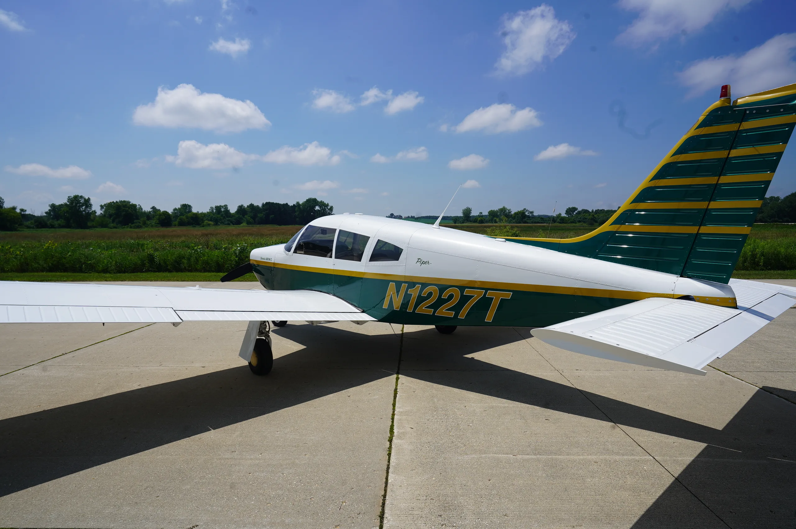 Exterior view of a 1972 Piper Arrow II, N1227T.