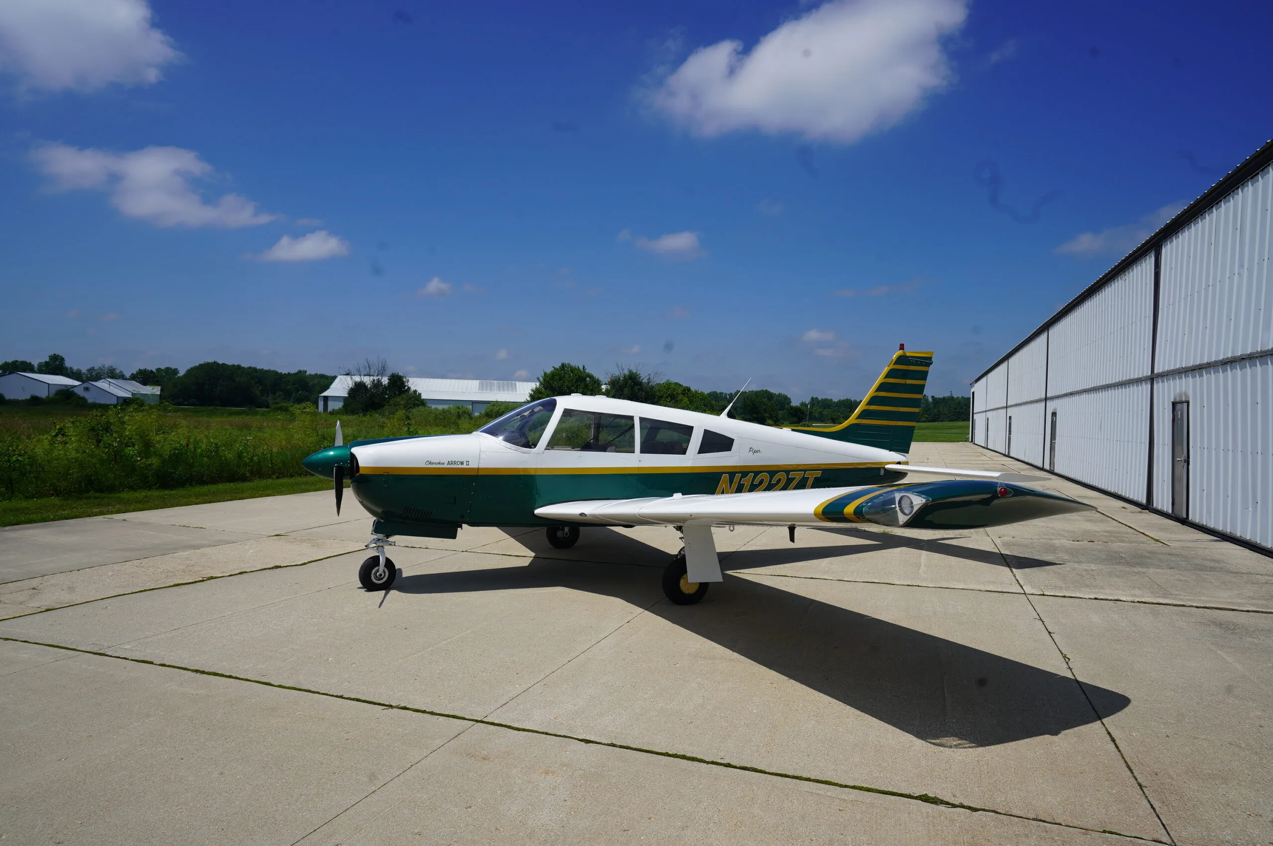 Exterior view of a 1972 Piper Arrow II, N1227T.